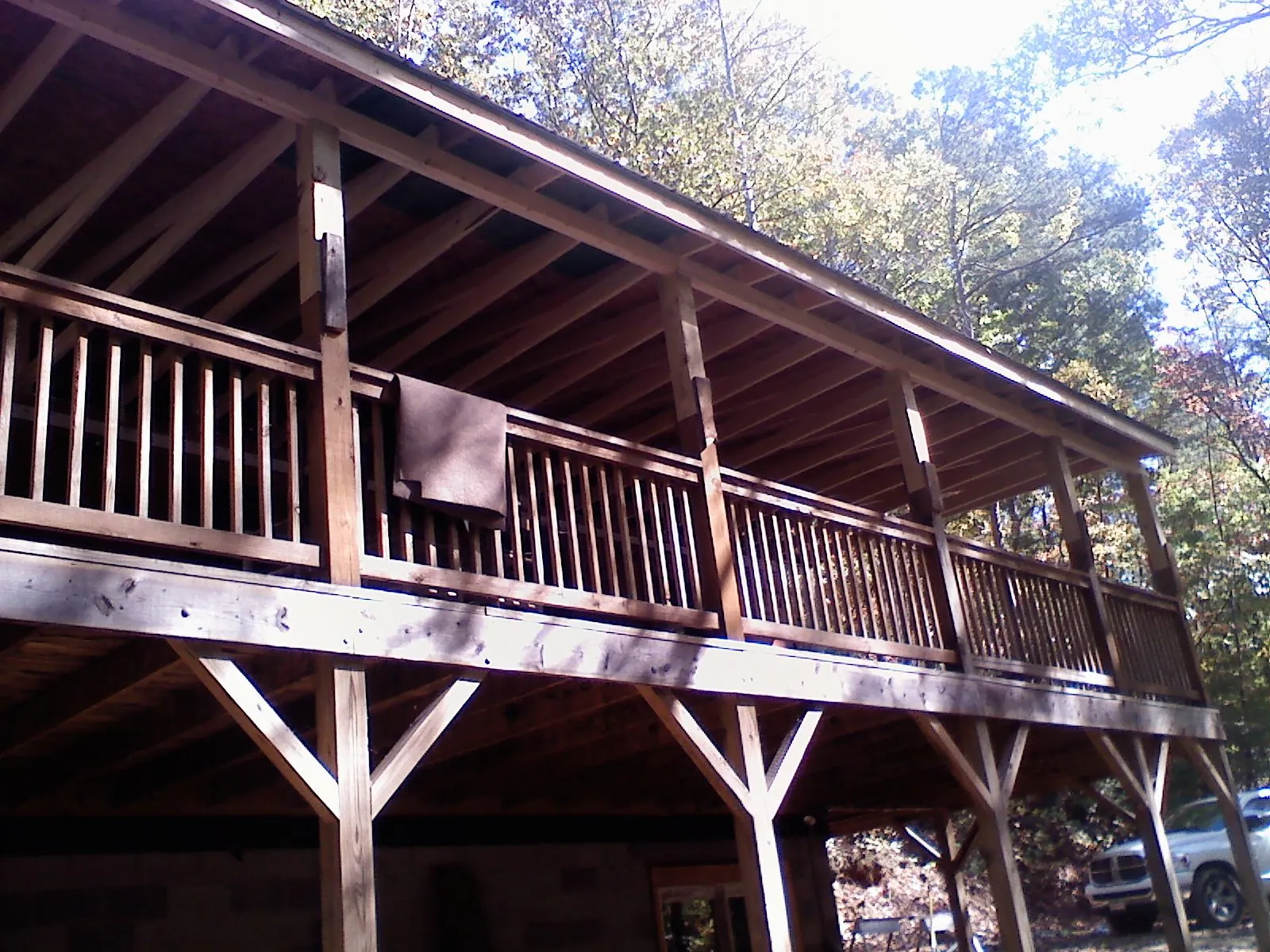 Timber framing under a new elevated porch and deck — Roof Leak Repair in Skaneateles Falls by Roofing Brothers